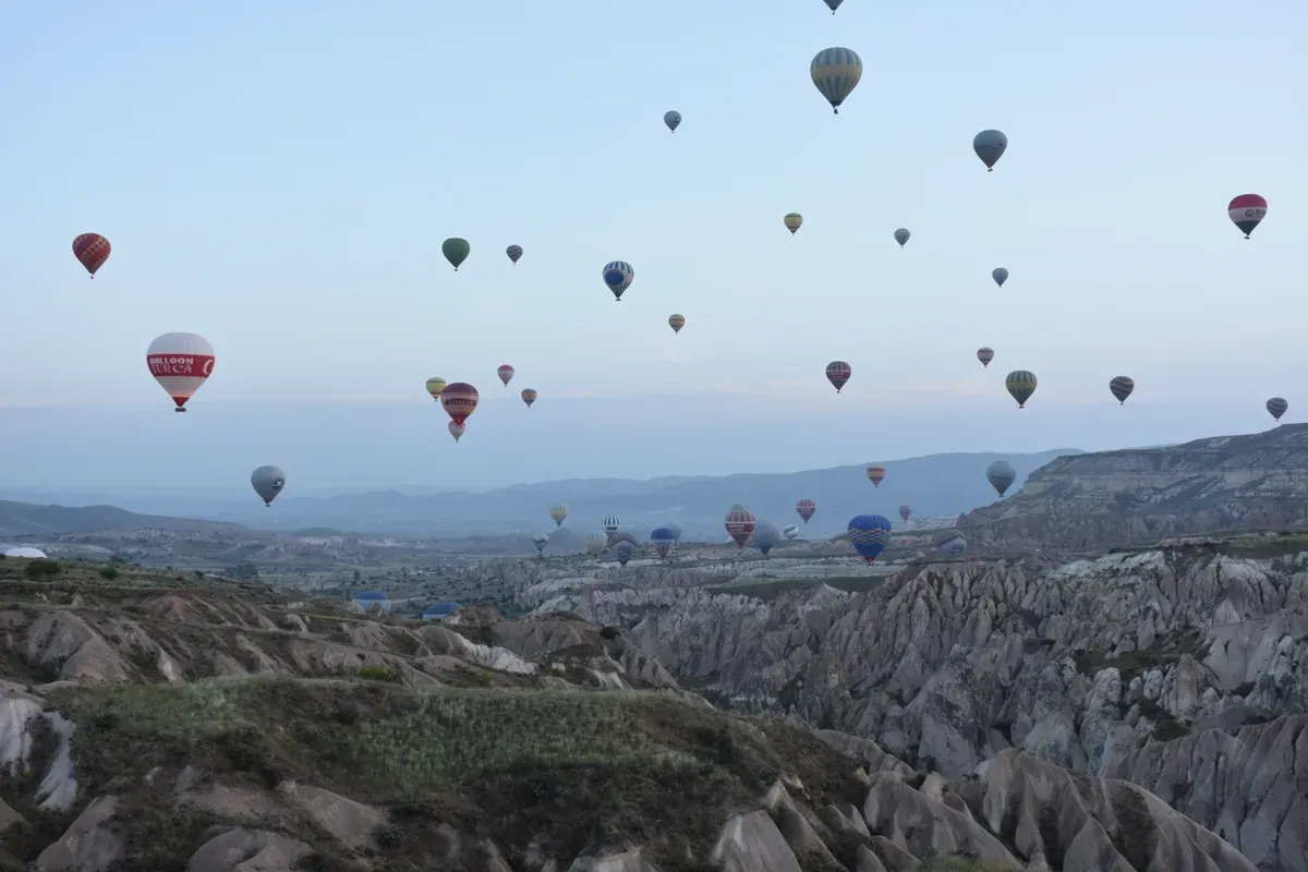 Balloons over the valleys near Goreme on a Turkey tour package