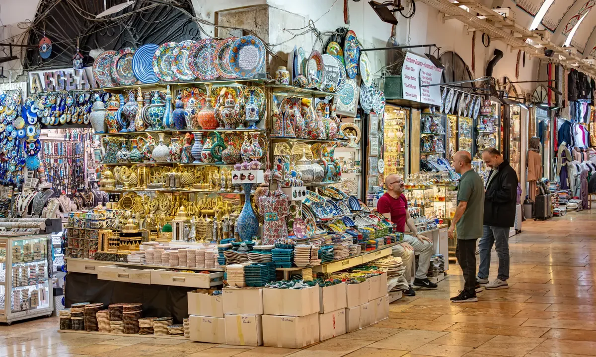 Lamp and ceramics stalls inside the Grand Bazaar in Istanbul, in a guide to Turkey trip cost