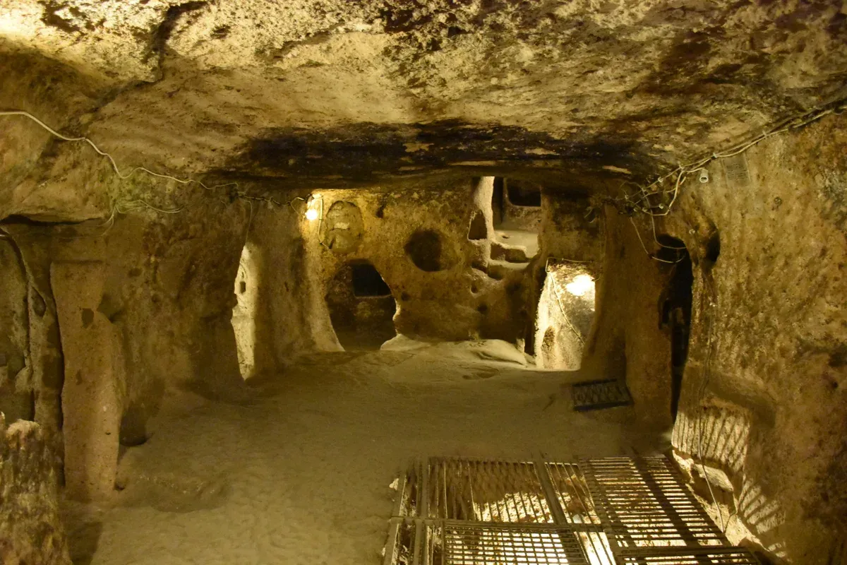 A carved room inside the Kaymakli Underground City on a Turkey tour package